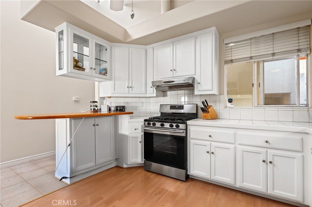 Interior, Kitchen, Stainless Steel Appliances, Tile Countertops, Wood Texture Flooring