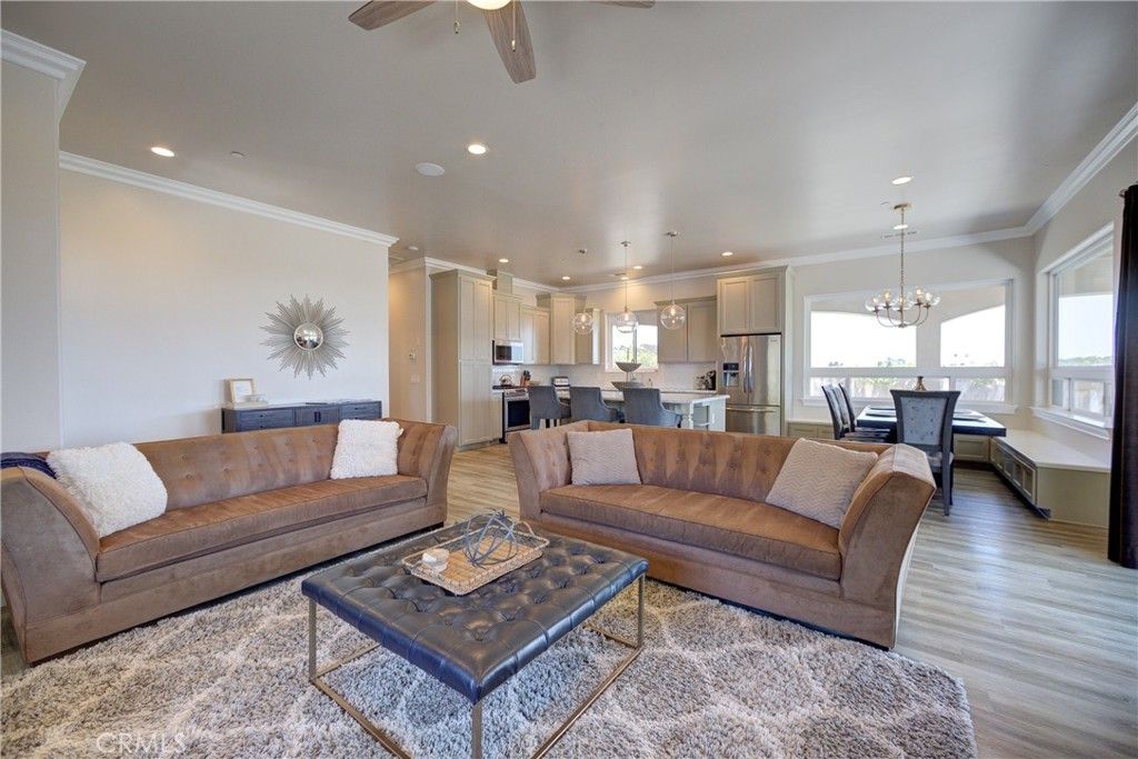 Chandelier, Dining room, Interior, Kitchen, Living room, Pendant Lights, Recessed Lighting, Stainless Steel Appliances, Wood Texture Flooring
