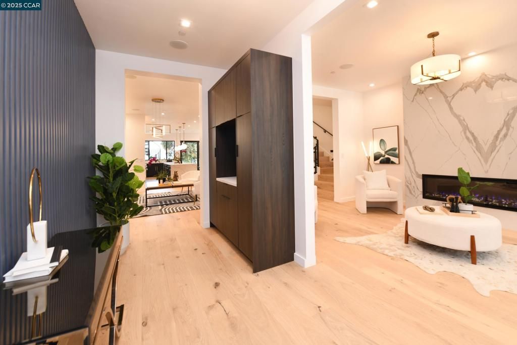 Fireplace, Interior, Living room, Marble Walls, Pendant Lights, Recessed Lighting, Wood Texture Flooring