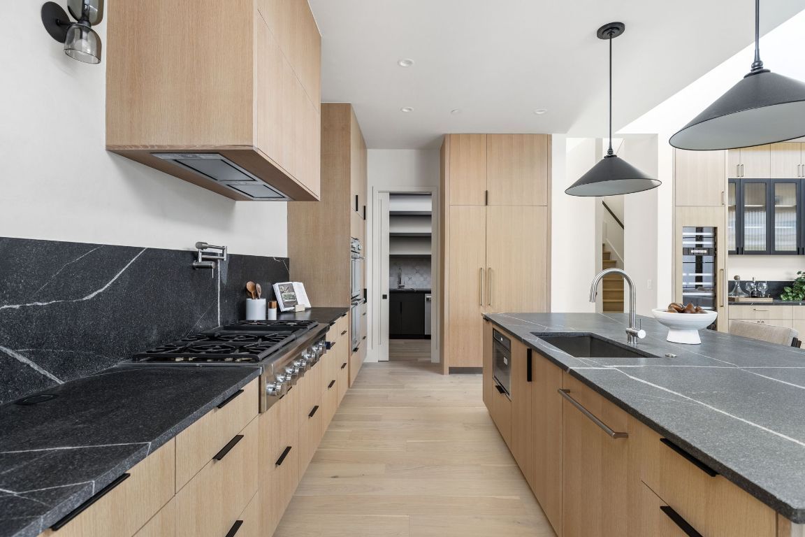 Interior, Kitchen, Pendant Lights, Recessed Lighting, Stainless Steel Appliances, Tile Countertops, Wood Texture Flooring