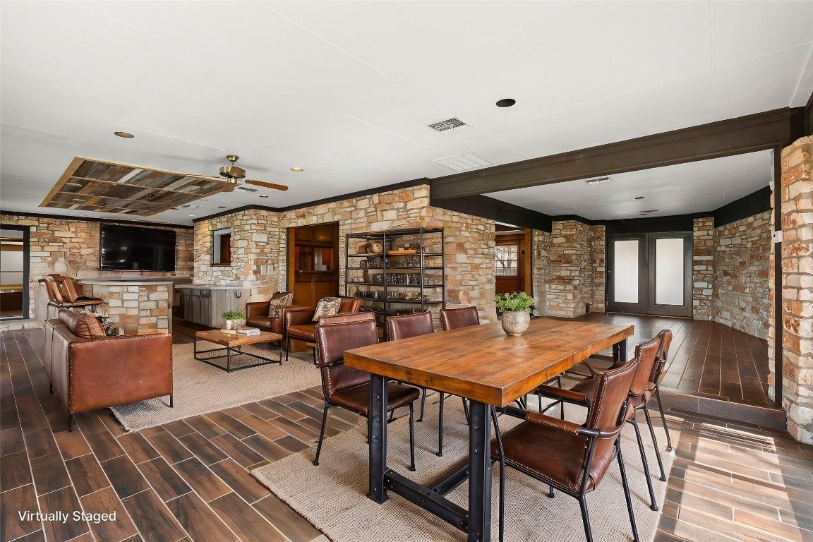 Dining room, Fireplace, Interior, Living room, Recessed Lighting, Stone Walls, Wood Texture Flooring