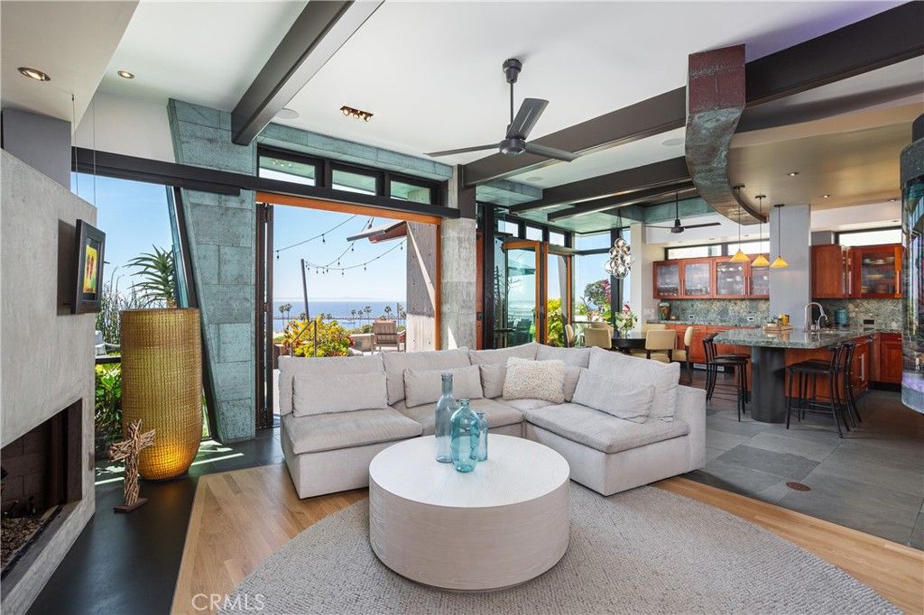 Dining room, Fireplace, Interior, Living room, Pendant Lights, Recessed Lighting, Water, Wood Texture Flooring