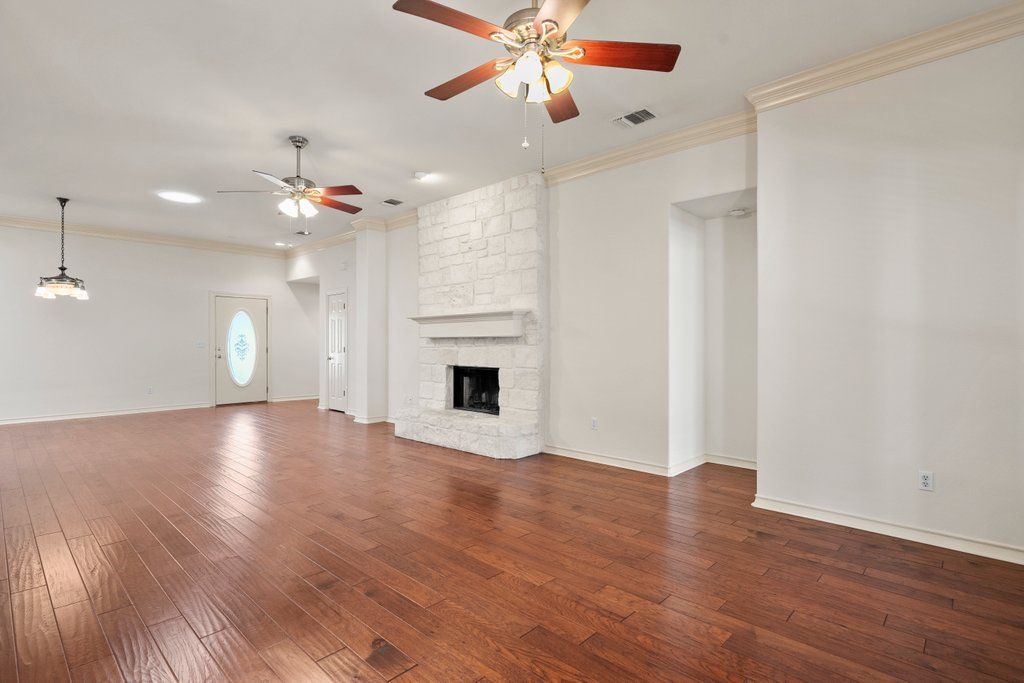 Empty room, Fireplace, Interior, Pendant Lights, Recessed Lighting, Stone Walls, Wood Texture Flooring