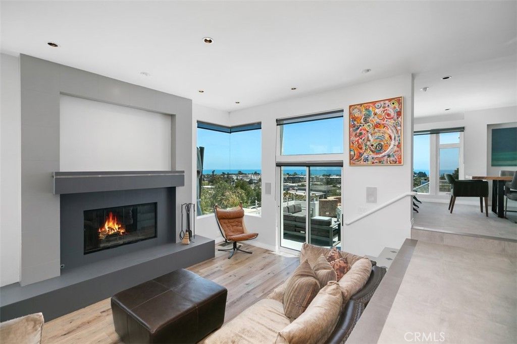 Dining room, Fireplace, Interior, Living room, Recessed Lighting, Water, Wood Texture Flooring