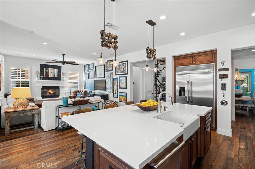 Fireplace, Interior, Kitchen, Living room, Pendant Lights, Recessed Lighting, Stainless Steel Appliances, Wood Texture Flooring
