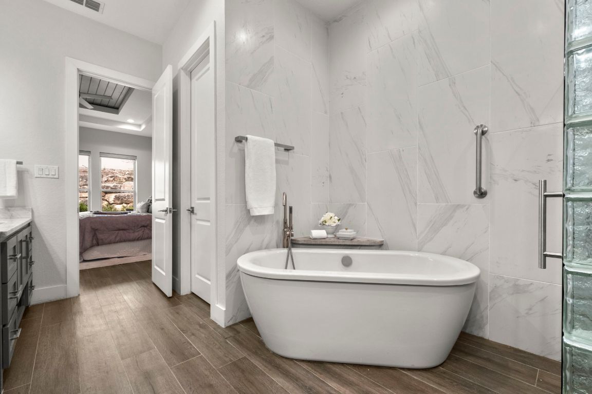 Bathroom, Free Standing Baths, Glass Shower, Interior, Marble Walls, Wood Texture Flooring