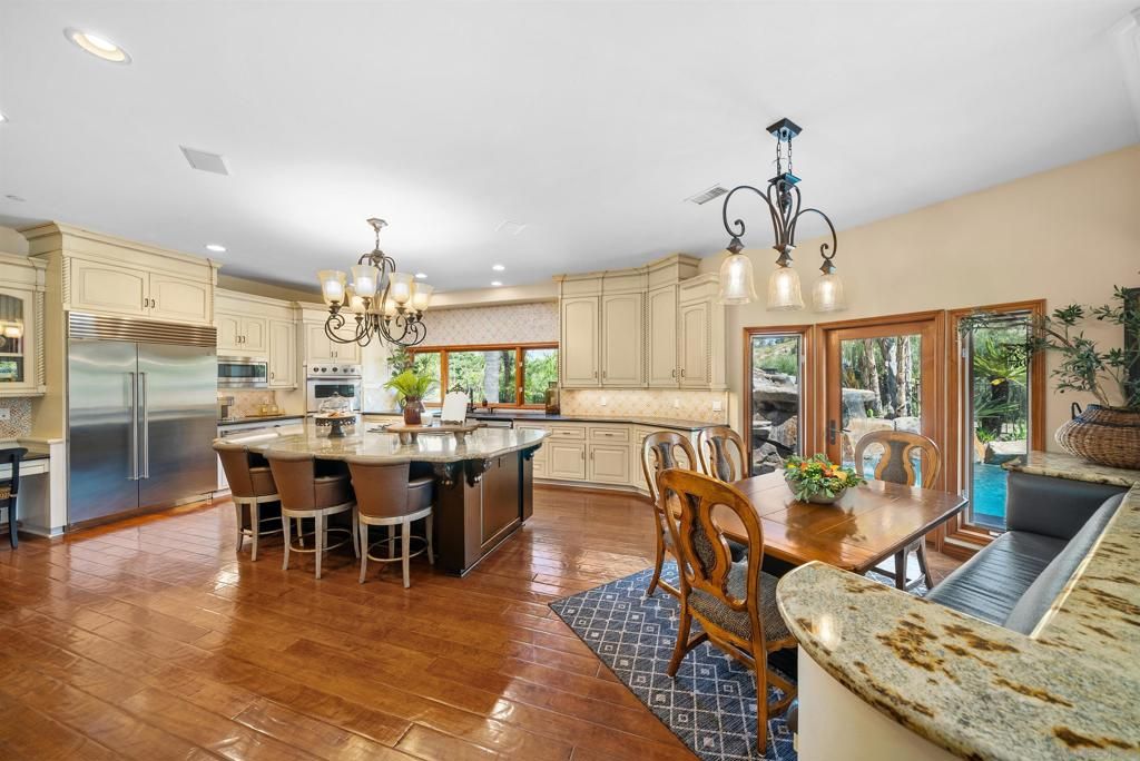 Chandelier, Dining room, Interior, Kitchen, Recessed Lighting, Stainless Steel Appliances, Wood Texture Flooring