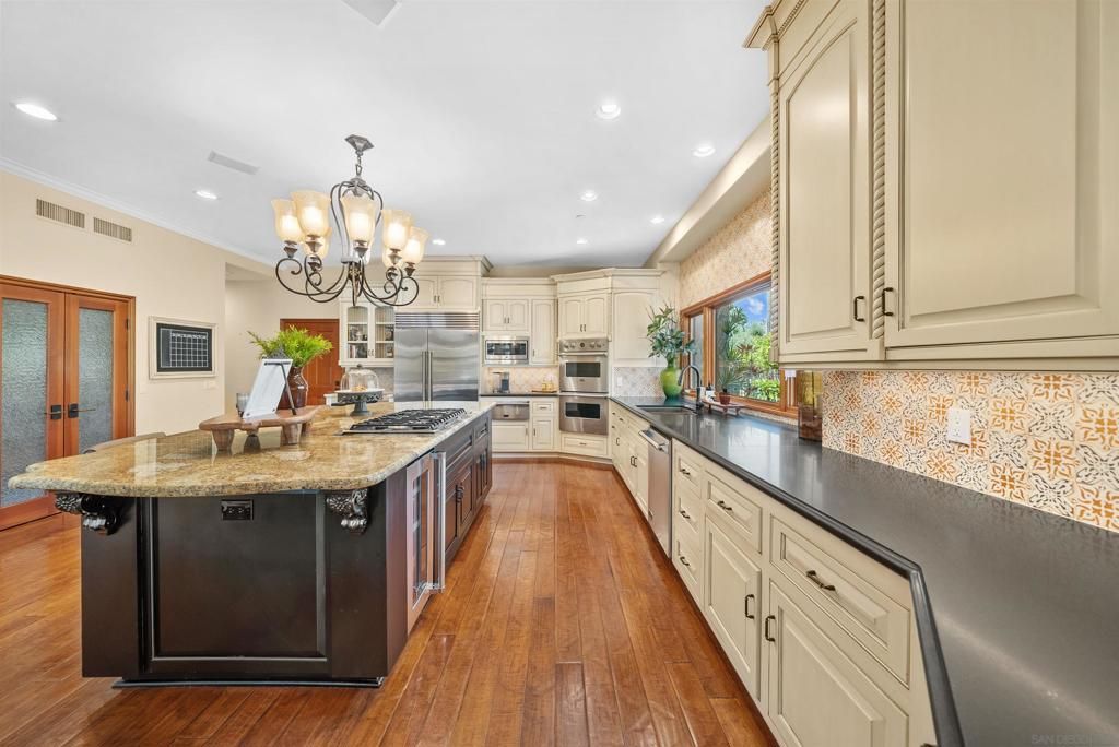 Chandelier, Interior, Kitchen, Recessed Lighting, Stainless Steel Appliances, Wood Texture Flooring