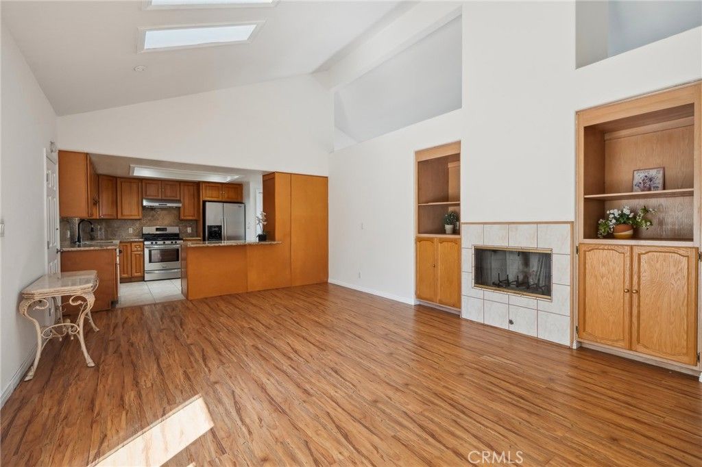 Fireplace, Interior, Kitchen, Stainless Steel Appliances, Wood Texture Flooring