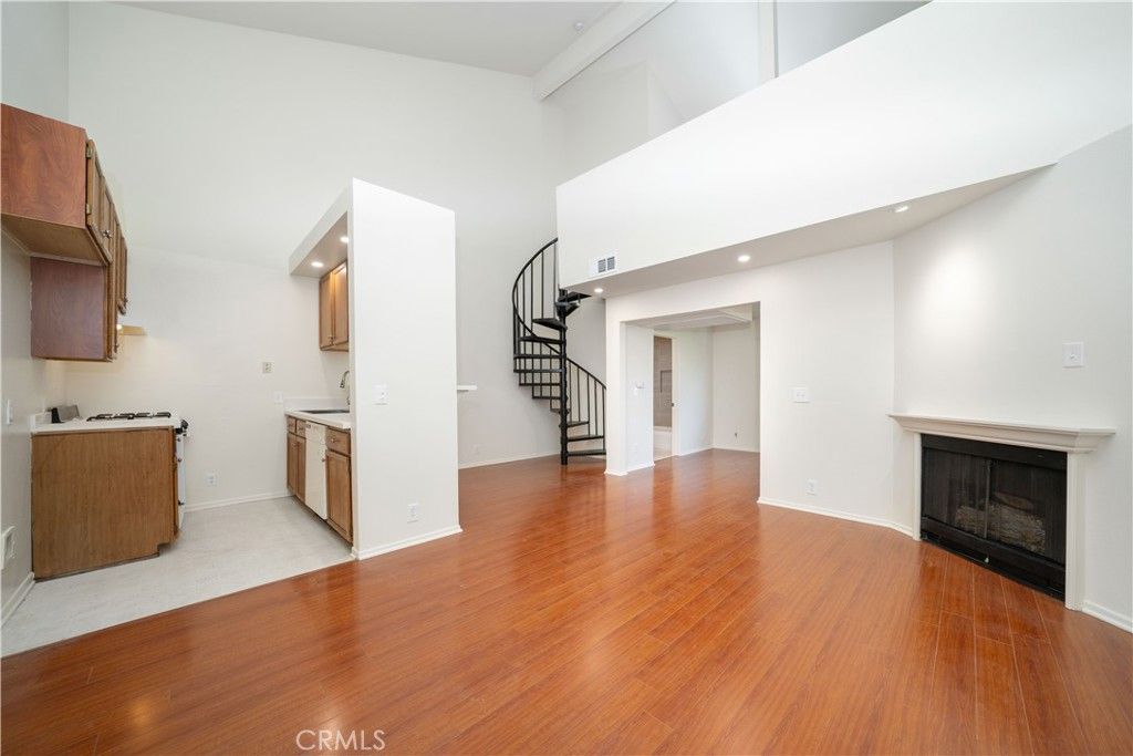 Empty room, Fireplace, Interior, Kitchen, Recessed Lighting, Wood Texture Flooring