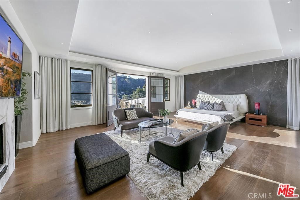 Fireplace, Interior, Living room, Marble Walls, Recessed Lighting, Wood Texture Flooring