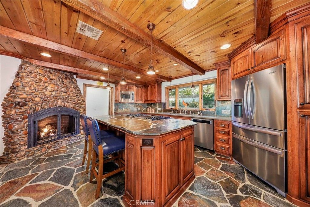 Fireplace, Interior, Kitchen, Pendant Lights, Recessed Lighting, Stainless Steel Appliances, Stone Walls, Wooden Beams, Wooden Ceilings