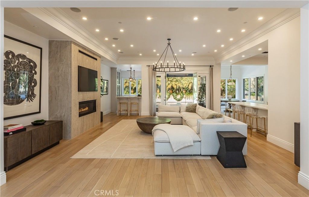 Chandelier, Fireplace, Interior, Living room, Pendant Lights, Recessed Lighting, Wood Texture Flooring