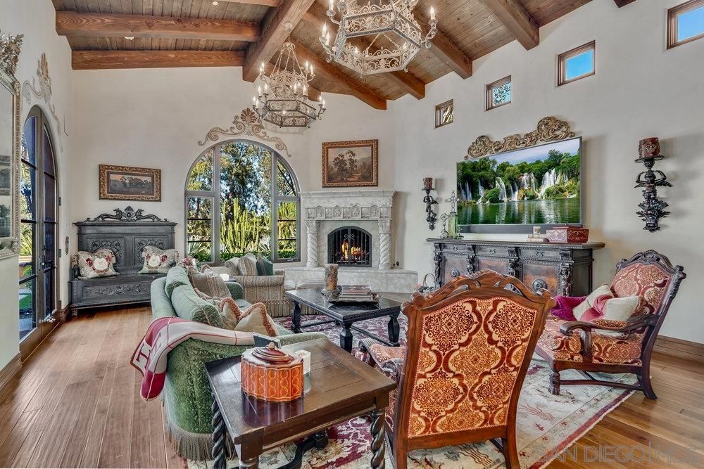 Chandelier, Fireplace, Interior, Living room, Recessed Lighting, Wooden Beams, Wooden Ceilings, Wood Texture Flooring
