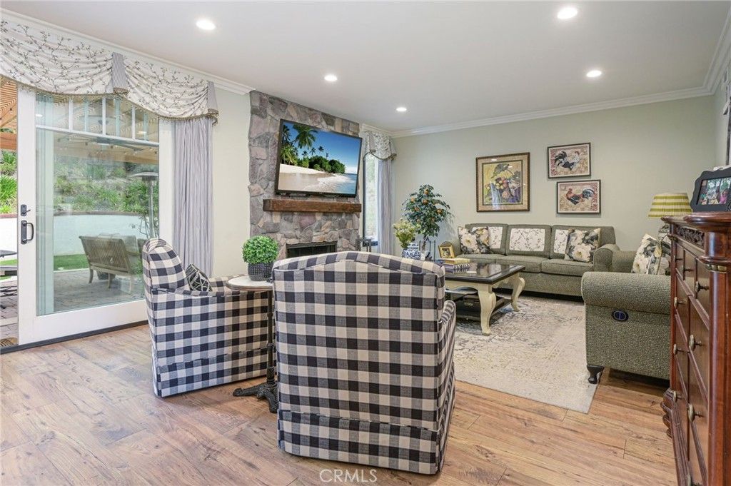 Fireplace, Interior, Living room, Recessed Lighting, Stone Walls, Wood Texture Flooring
