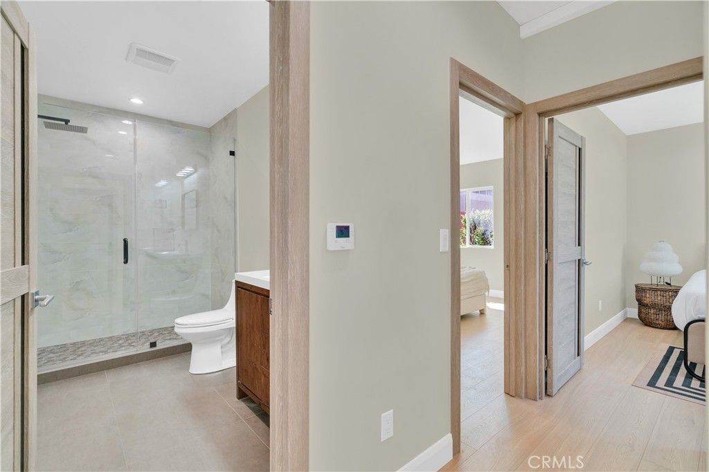 Bathroom, Glass Shower, Interior, Marble Walls, Recessed Lighting, Wood Texture Flooring
