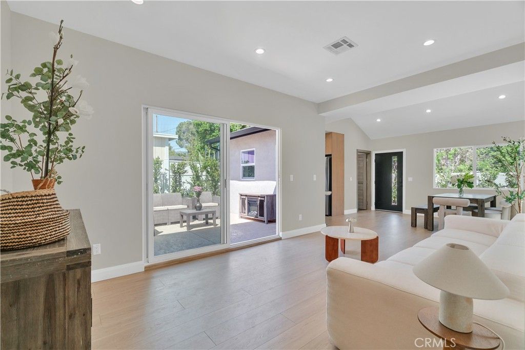 Dining room, Fireplace, Interior, Living room, Recessed Lighting, Wood Texture Flooring