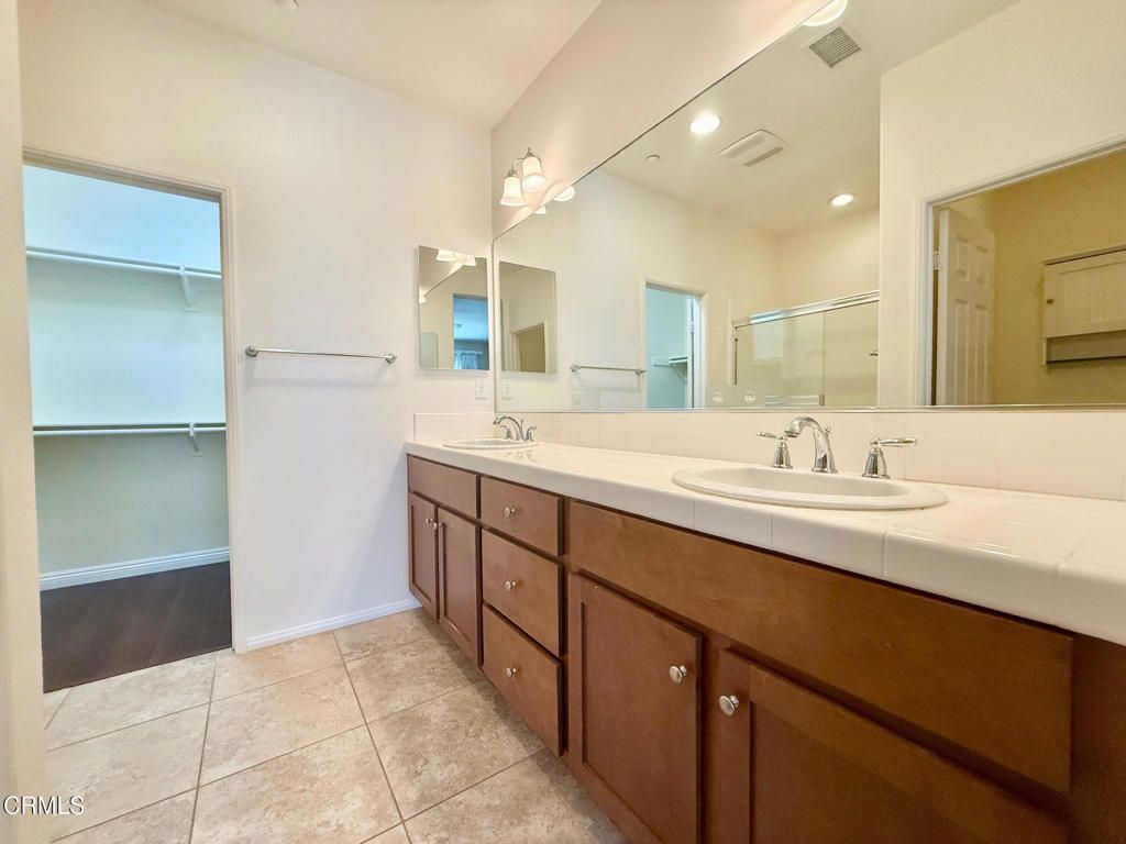 Bathroom, Dual Sink Vanities, Interior, Recessed Lighting, Tile Countertops, Wood Texture Flooring