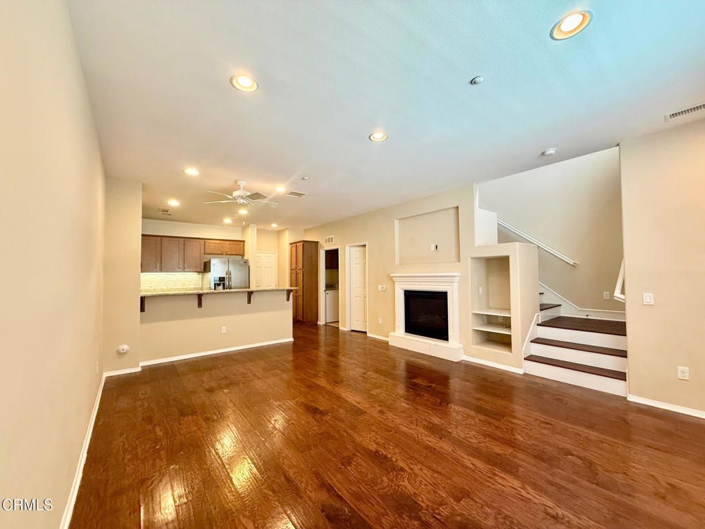 Empty room, Fireplace, Interior, Kitchen, Recessed Lighting, Wood Texture Flooring