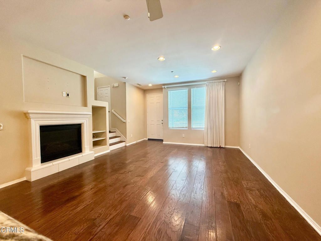 Empty room, Fireplace, Interior, Recessed Lighting, Wood Texture Flooring