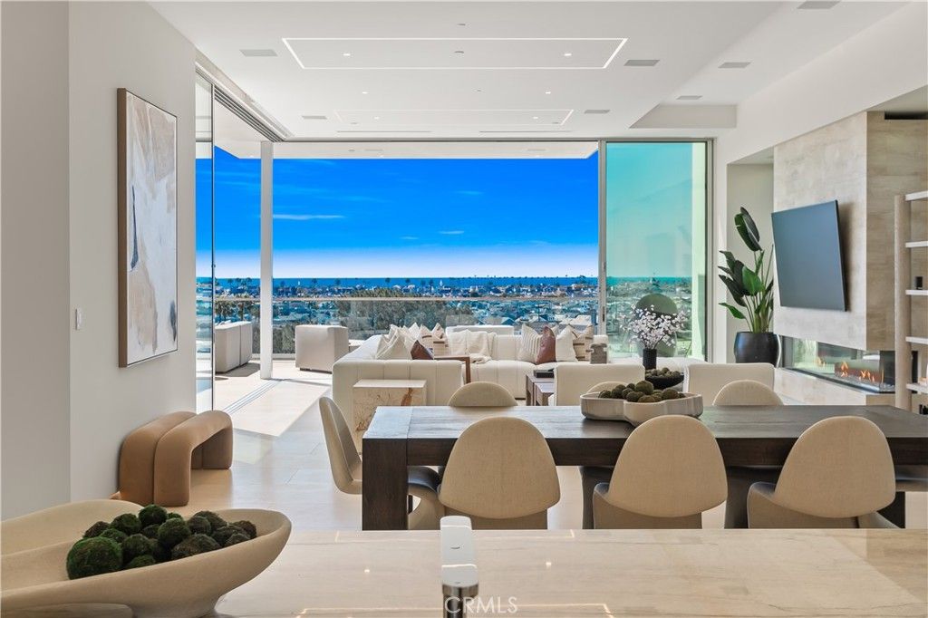 Dining room, Fireplace, Interior, Living room, Recessed Lighting, Water, Wood Texture Flooring