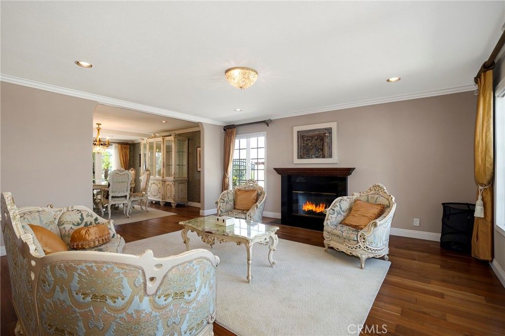 Chandelier, Dining room, Fireplace, Interior, Living room, Recessed Lighting, Wood Texture Flooring