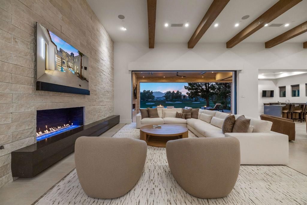Dining room, Fireplace, Interior, Living room, Recessed Lighting, Stone Walls, Water, Wooden Beams