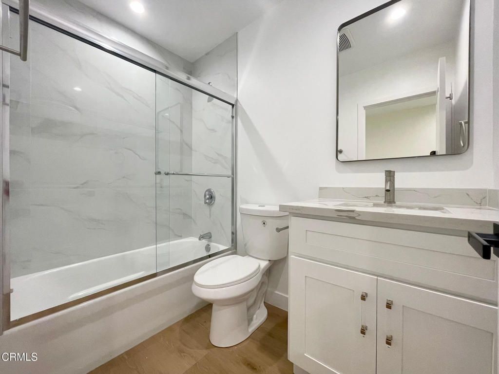 Bathroom, Glass Shower, Interior, Marble Walls, Recessed Lighting, Wood Texture Flooring