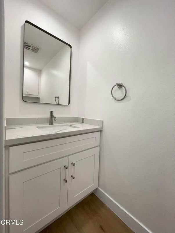 Bathroom, Dual Sink Vanities, Interior, Recessed Lighting, Wood Texture Flooring