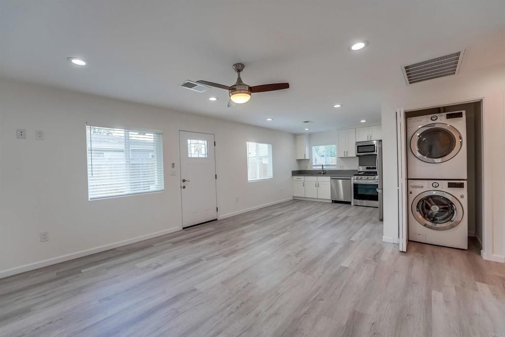 Interior, Kitchen, Recessed Lighting, Stainless Steel Appliances, Washer, Wood Texture Flooring