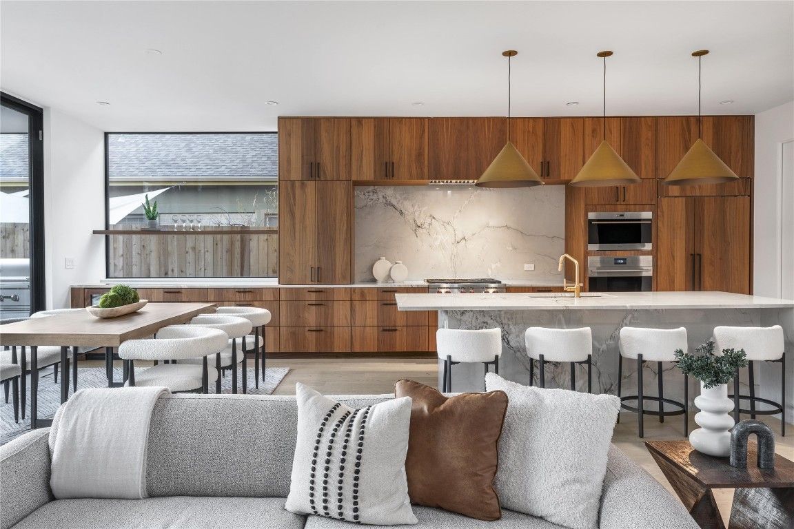 Dining room, Interior, Kitchen, Pendant Lights, Recessed Lighting, Stainless Steel Appliances, Wood Texture Flooring