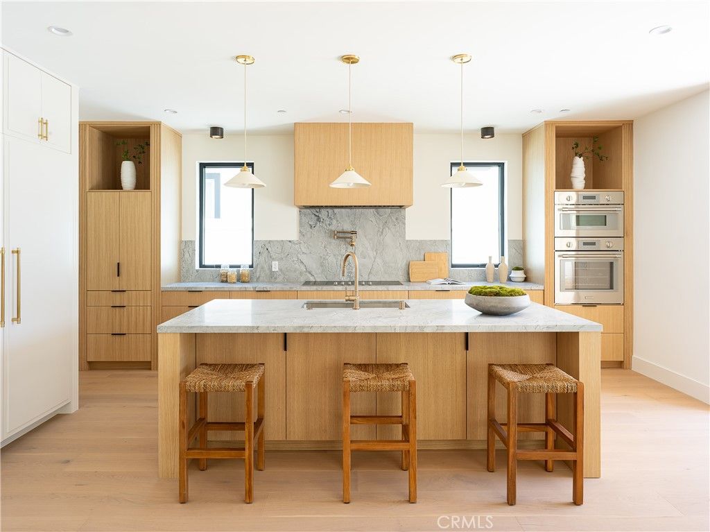 Interior, Kitchen, Marble Walls, Pendant Lights, Recessed Lighting, Stainless Steel Appliances, Wood Texture Flooring