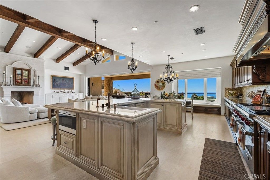 Chandelier, Fireplace, Interior, Kitchen, Living room, Pendant Lights, Recessed Lighting, Water, Wooden Beams