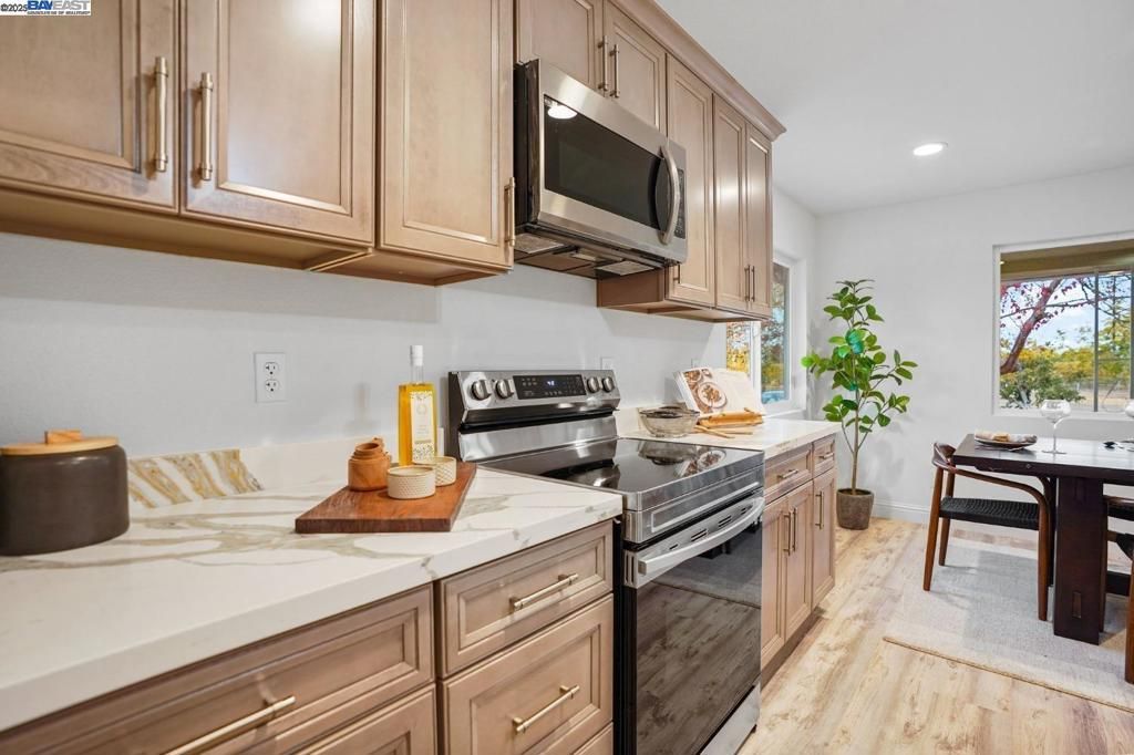 Dining room, Interior, Kitchen, Recessed Lighting, Stainless Steel Appliances, Wood Texture Flooring