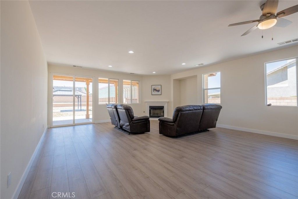 Empty room, Fireplace, Interior, Living room, Recessed Lighting, Wood Texture Flooring