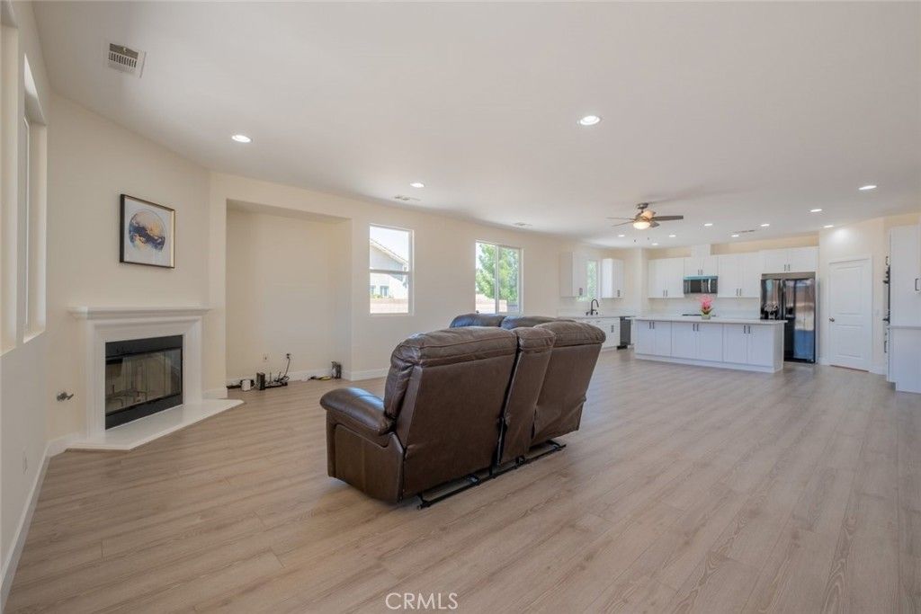 Fireplace, Interior, Kitchen, Living room, Recessed Lighting, Stainless Steel Appliances, Wood Texture Flooring