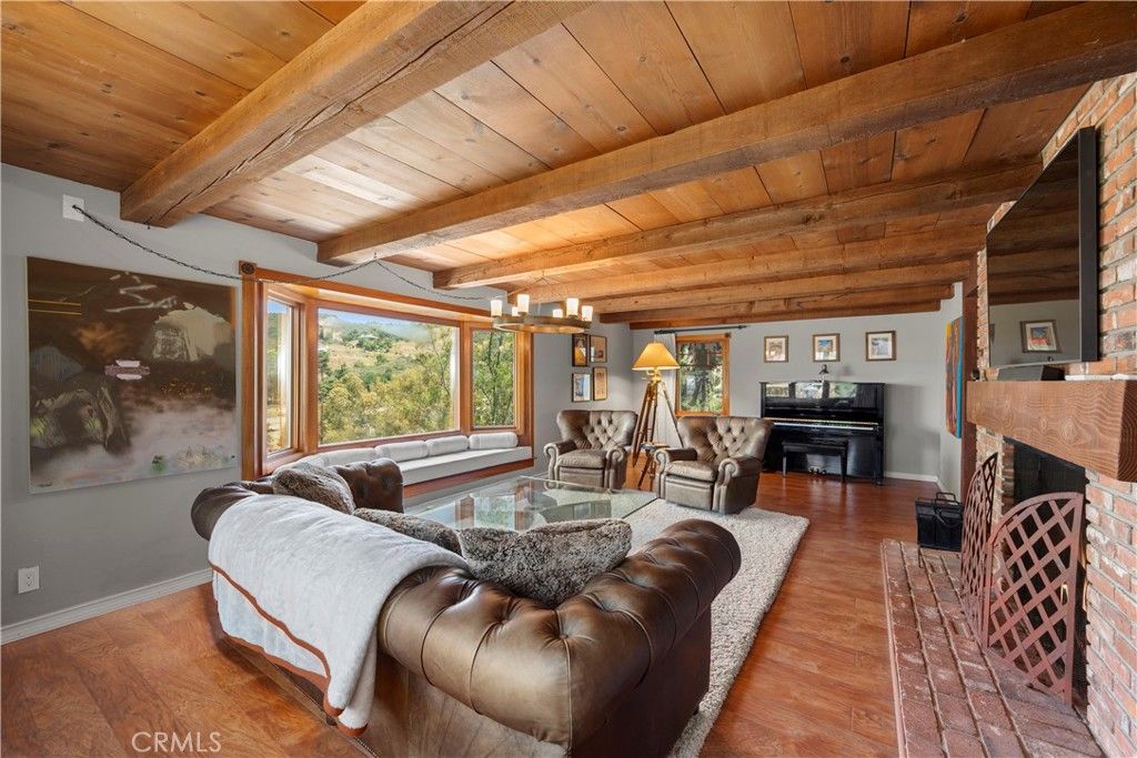 Chandelier, Fireplace, Interior, Living room, Piano, Wooden Beams, Wooden Ceilings, Wood Texture Flooring