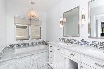 Bathroom, Chandelier, Dual Sink Vanities, Interior, Marble, Pendant Lights