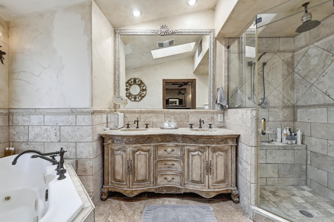 Bathroom, Dual Sink Vanities, Glass Shower, Interior, Recessed Lighting, Stone Walls