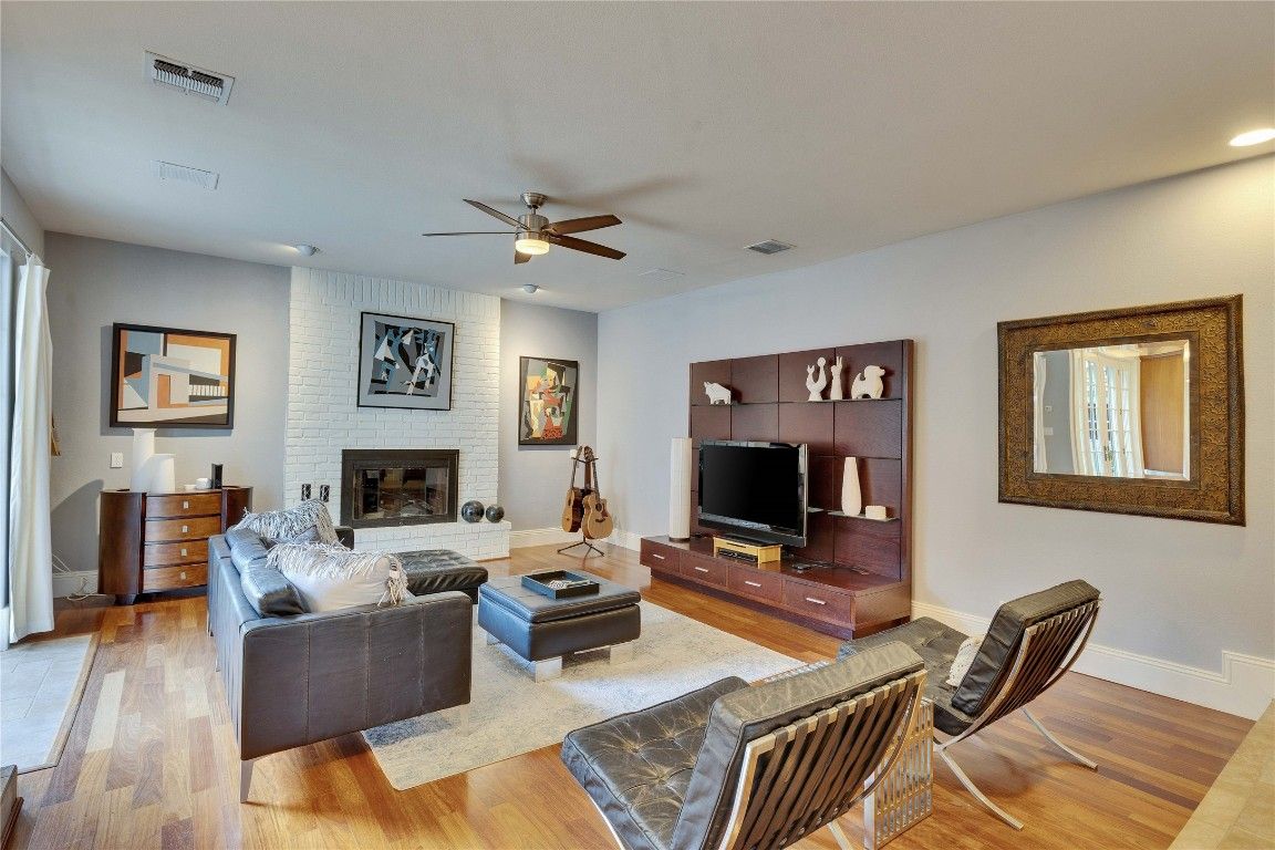 Fireplace, Interior, Living room, Recessed Lighting, Stone Walls, Wood Texture Flooring