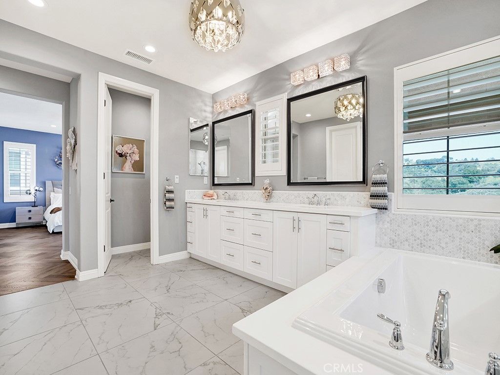Bathroom, Chandelier, Dual Sink Vanities, Interior, Marble, Recessed Lighting, Wood Texture Flooring