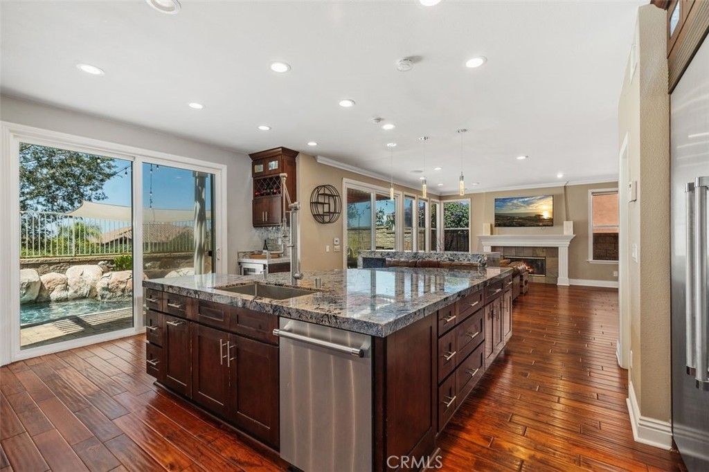 Fireplace, Interior, Kitchen, Pendant Lights, Recessed Lighting, Stainless Steel Appliances, Wood Texture Flooring
