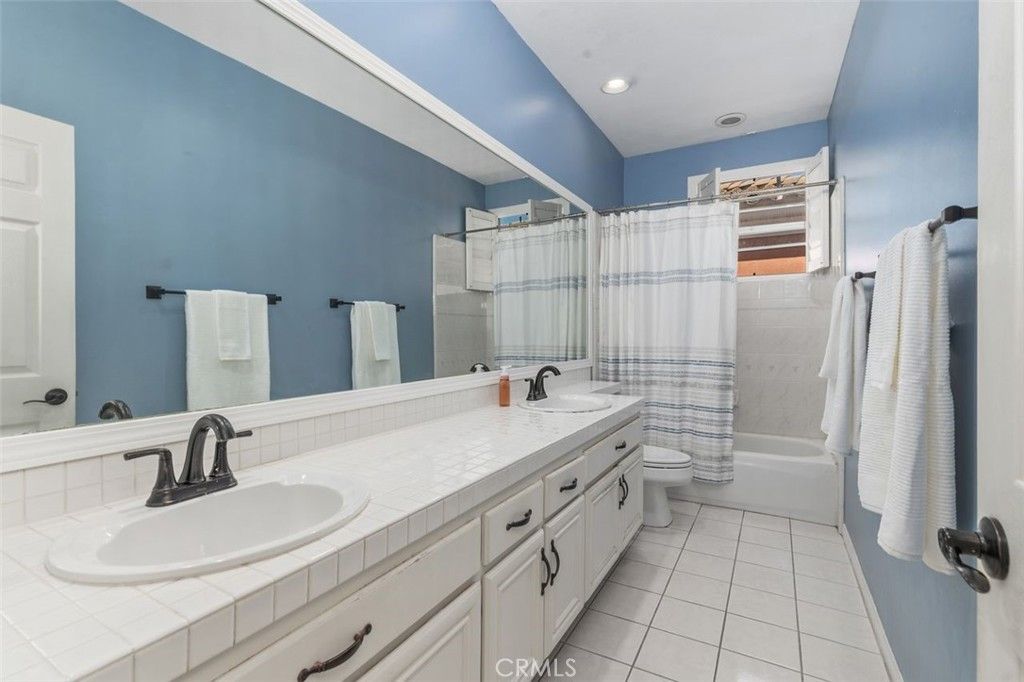 Bathroom, Dual Sink Vanities, Interior, Recessed Lighting, Tile Countertops