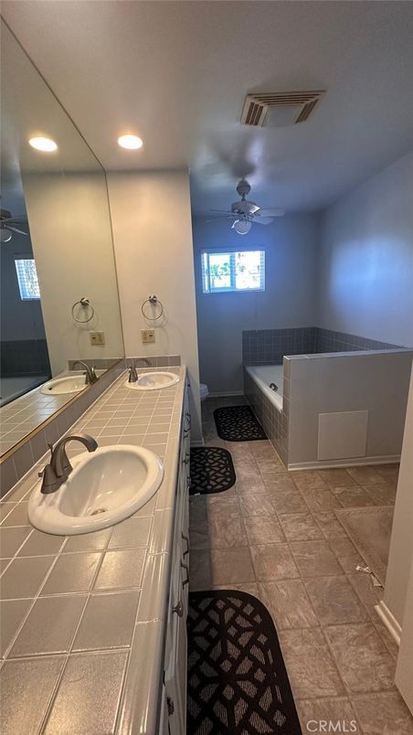 Bathroom, Dual Sink Vanities, Interior, Recessed Lighting, Tile Countertops