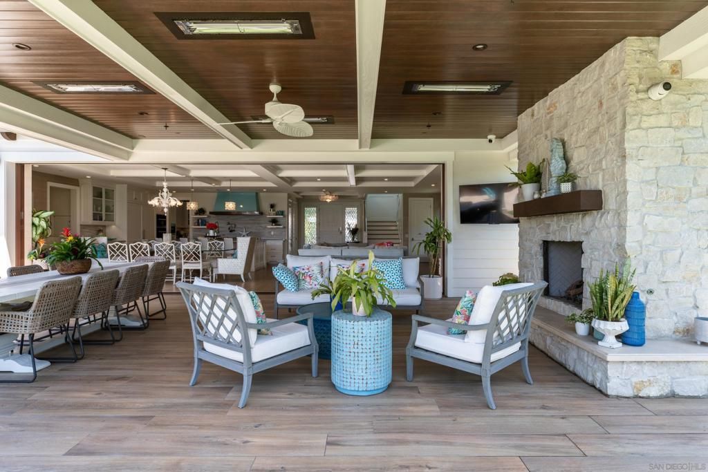 Chandelier, Dining room, Fireplace, Interior, Living room, Recessed Lighting, Stone Walls, Wooden Ceilings, Wood Texture Flooring