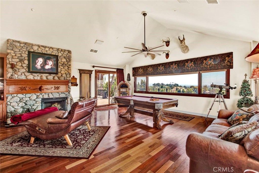 Billiard Table, Fireplace, Game Room, Interior, Living room, Stone Walls, Wood Texture Flooring