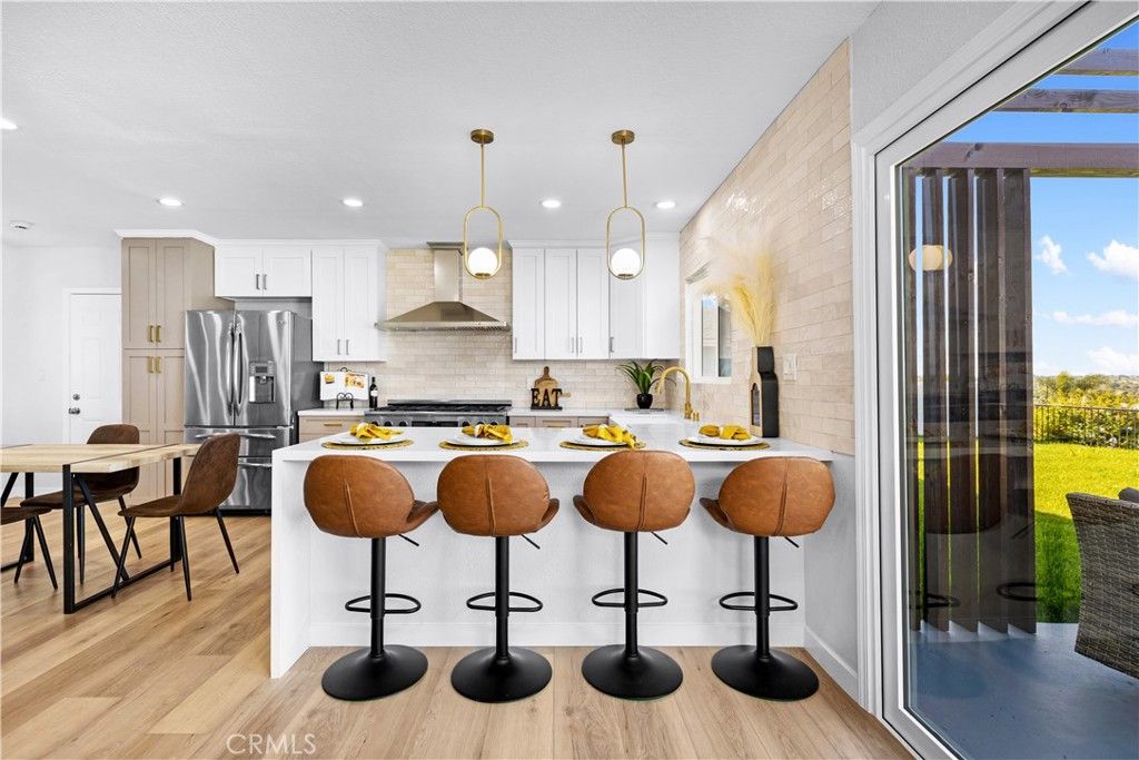 Dining room, Interior, Kitchen, Pendant Lights, Recessed Lighting, Stainless Steel Appliances, Wood Texture Flooring