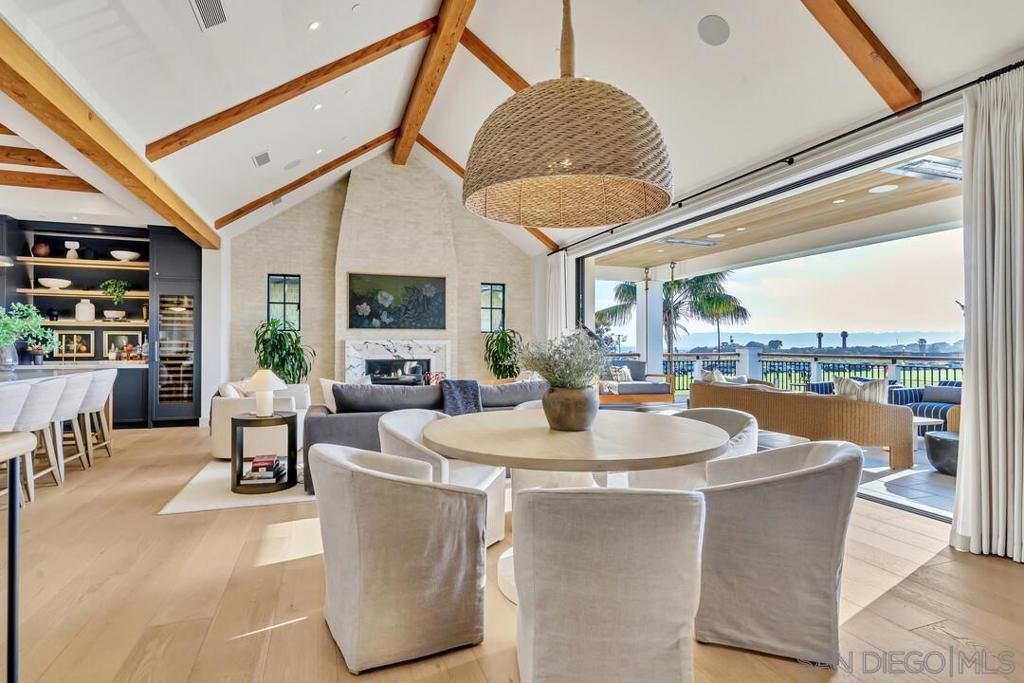 Dining room, Fireplace, Interior, Living room, Recessed Lighting, Water, Wooden Beams, Wood Texture Flooring