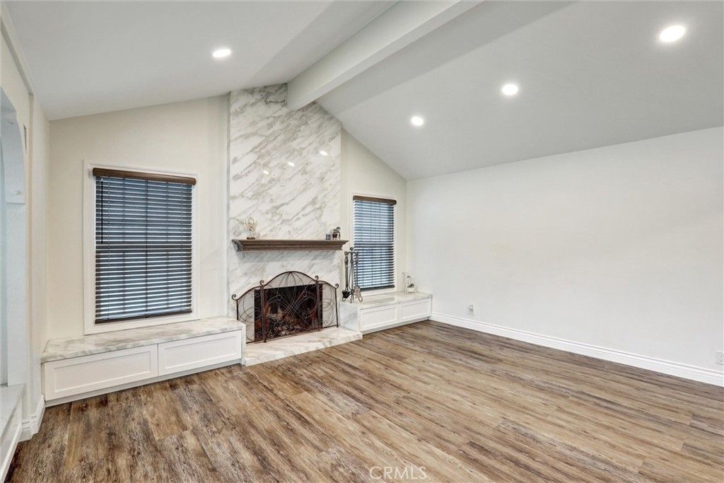 Empty room, Fireplace, Interior, Marble Walls, Recessed Lighting, Wood Texture Flooring