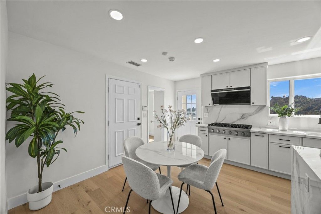 Dining room, Interior, Kitchen, Marble Walls, Recessed Lighting, Stainless Steel Appliances, Wood Texture Flooring